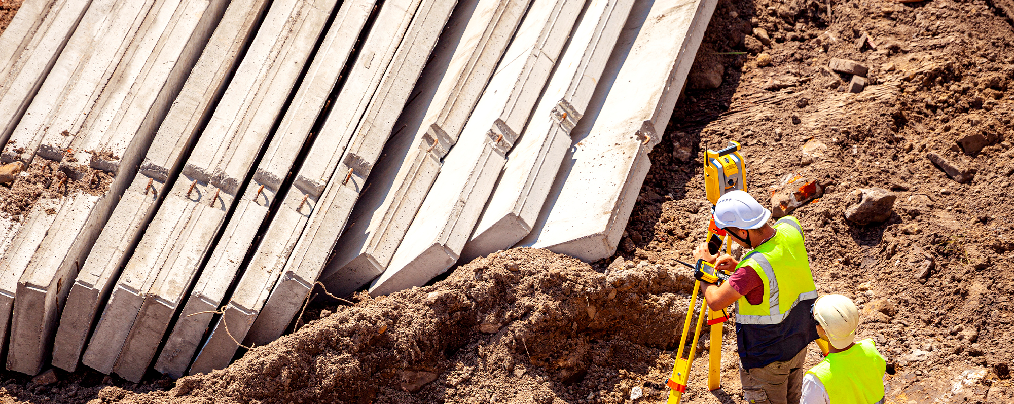 Surveyors working at new construction site